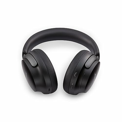 Black over-ear wireless headphones on a white background