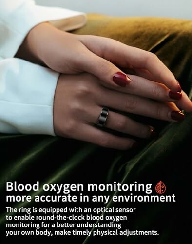 Hand wearing a ring for blood oxygen monitoring.