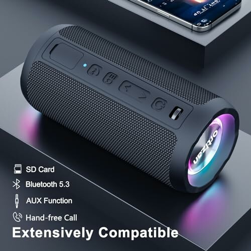 Portable Bluetooth speaker with compatibility features displayed next to a smartphone.