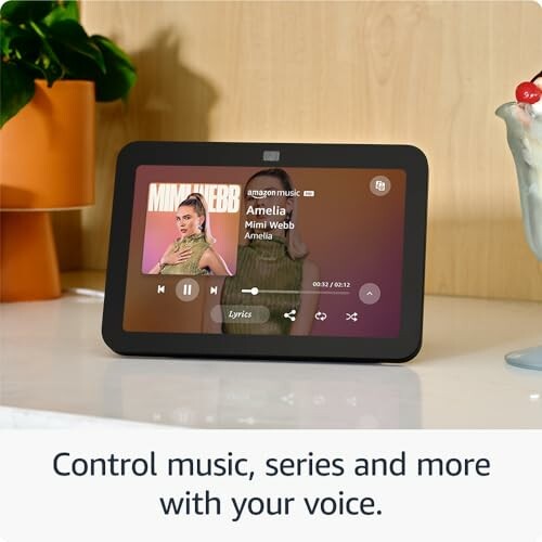 Smart display on table playing music with voice control feature