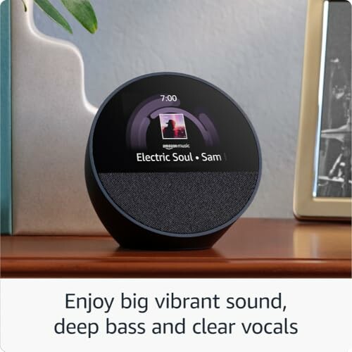 Smart speaker with screen displaying music and text about sound quality.