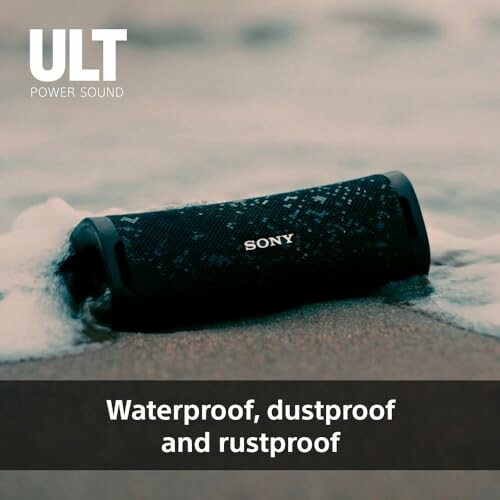 Bluetooth speaker on wet sand demonstrating waterproof feature